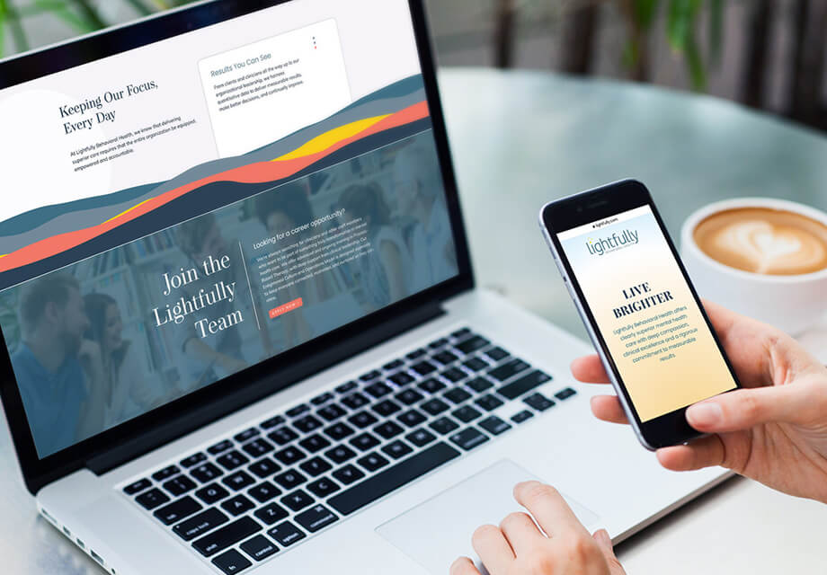 Laptop & Iphone on a desk showing more of Martha Chang’s content for Lightfully Behavioral Health